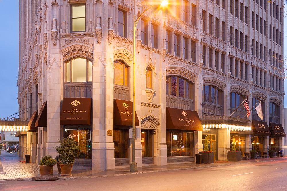 The street-level view of the Emily Morgan Hotel at dusk.