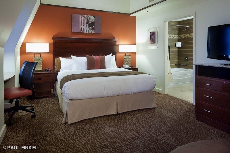 King bed guestroom at Emily Morgan hotel.