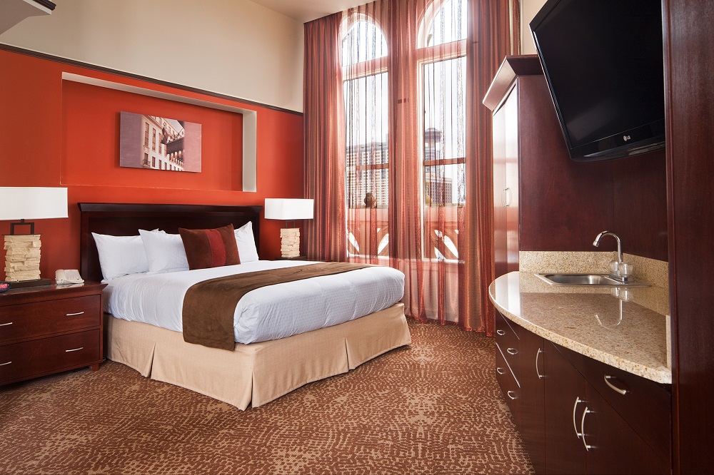 King bed guestroom at Emily Morgan Hotel.