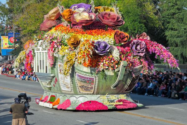 A large flower float at a flower parade.