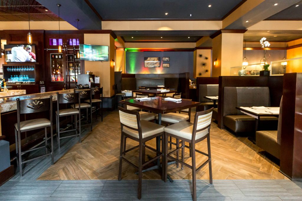 High top tables and chairs in Oro Restaurant and Bar in the Emily Morgan Hotel.