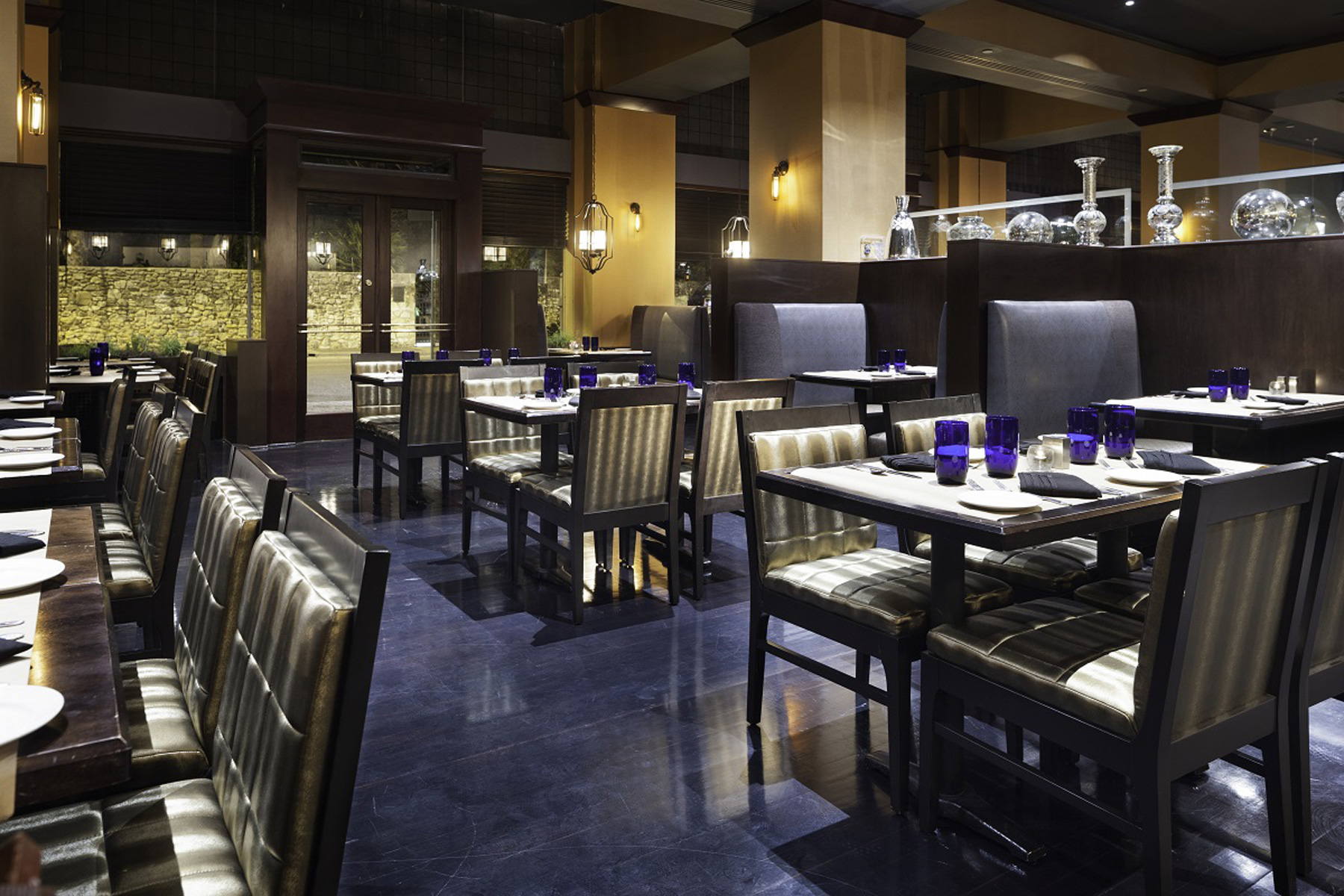 Tables and chairs in Oro Restaurant and Bar in the Emily Morgan Hotel.